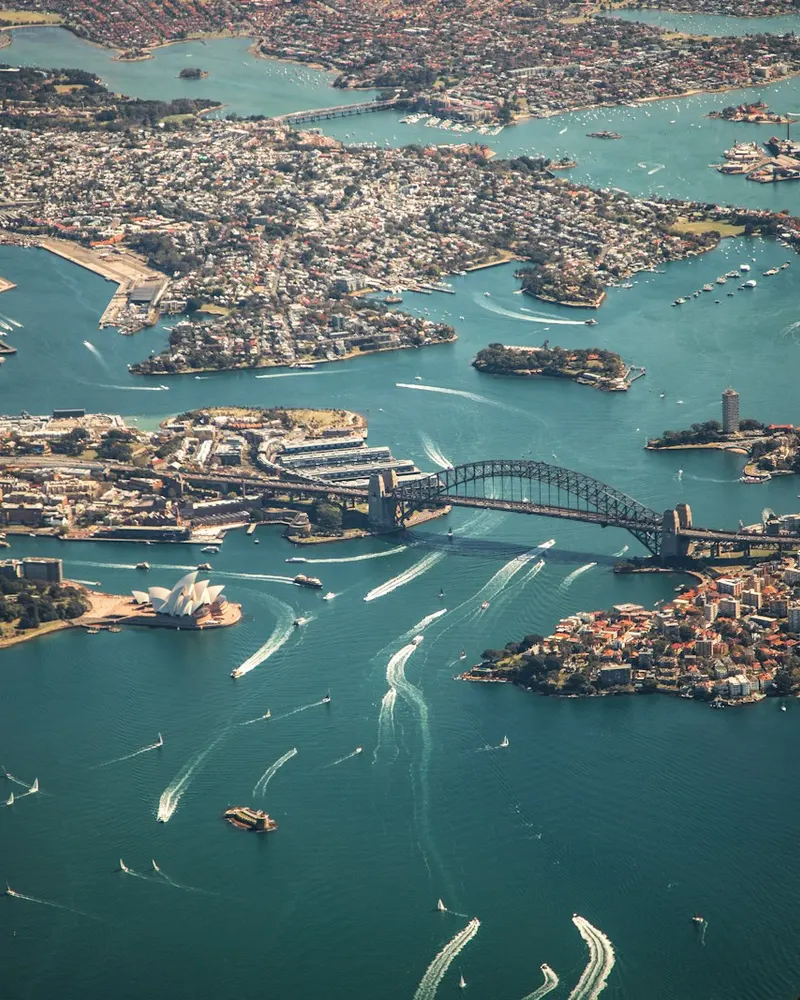 An aerial view of the Sydney Harbour Bridge and Opera House in Sydney, Australia