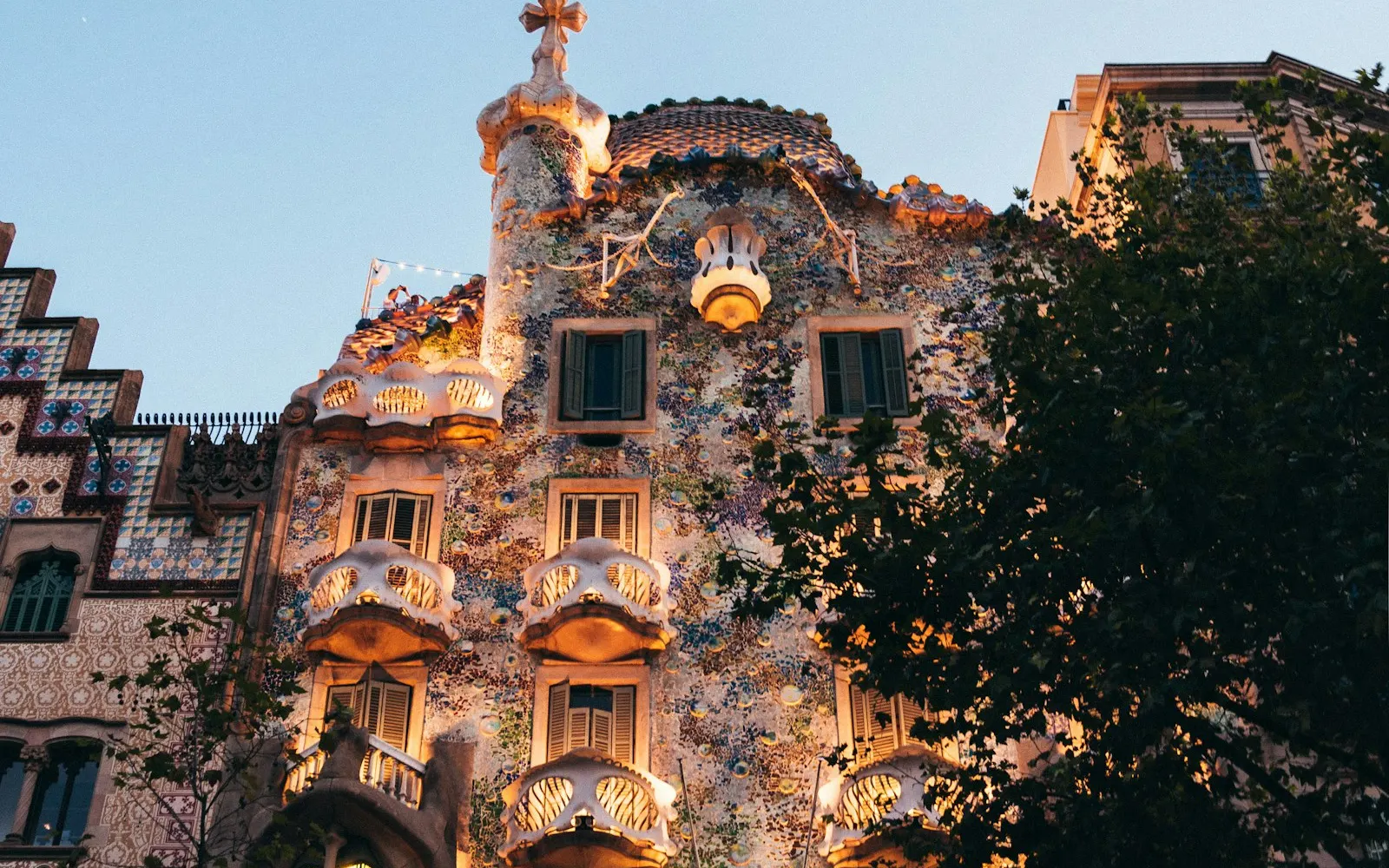 The ornate facade of Casa Batllo with mosaic tiles in Barcelona, Spain