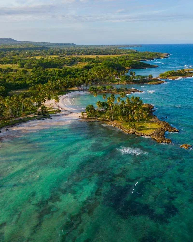 an aerial view of a beach and ocean
