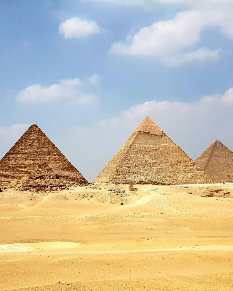 brown pyramid under blue sky during daytime