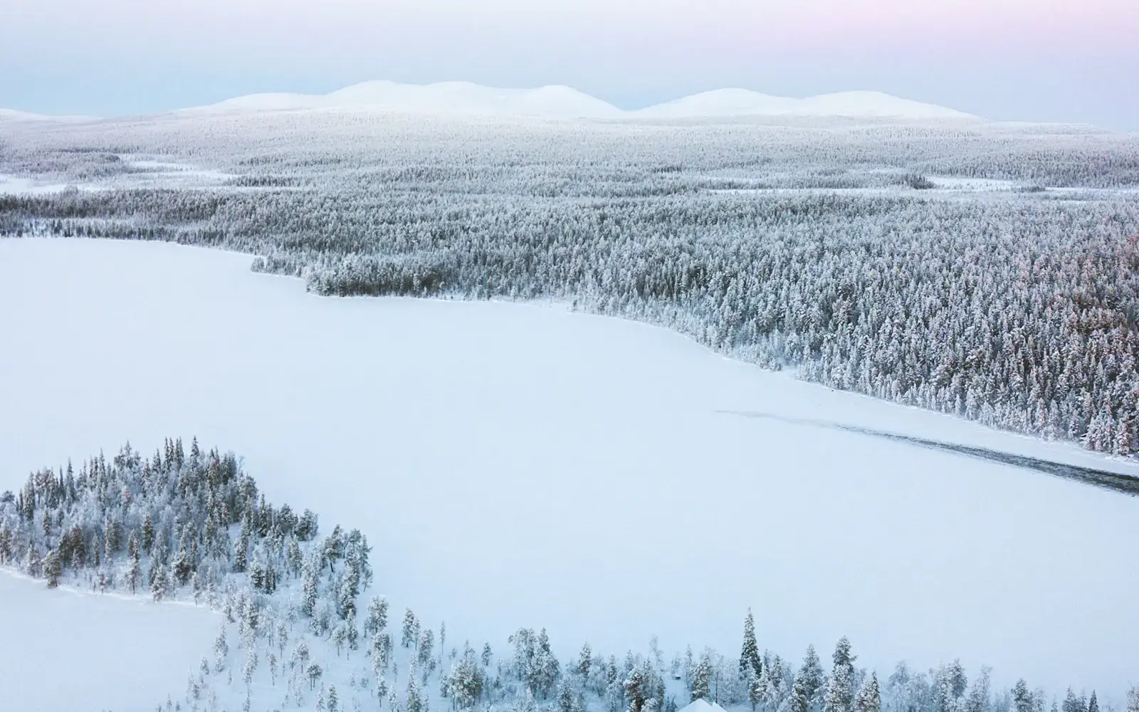 Snow-covered forest in Finnish Lapland seen from above