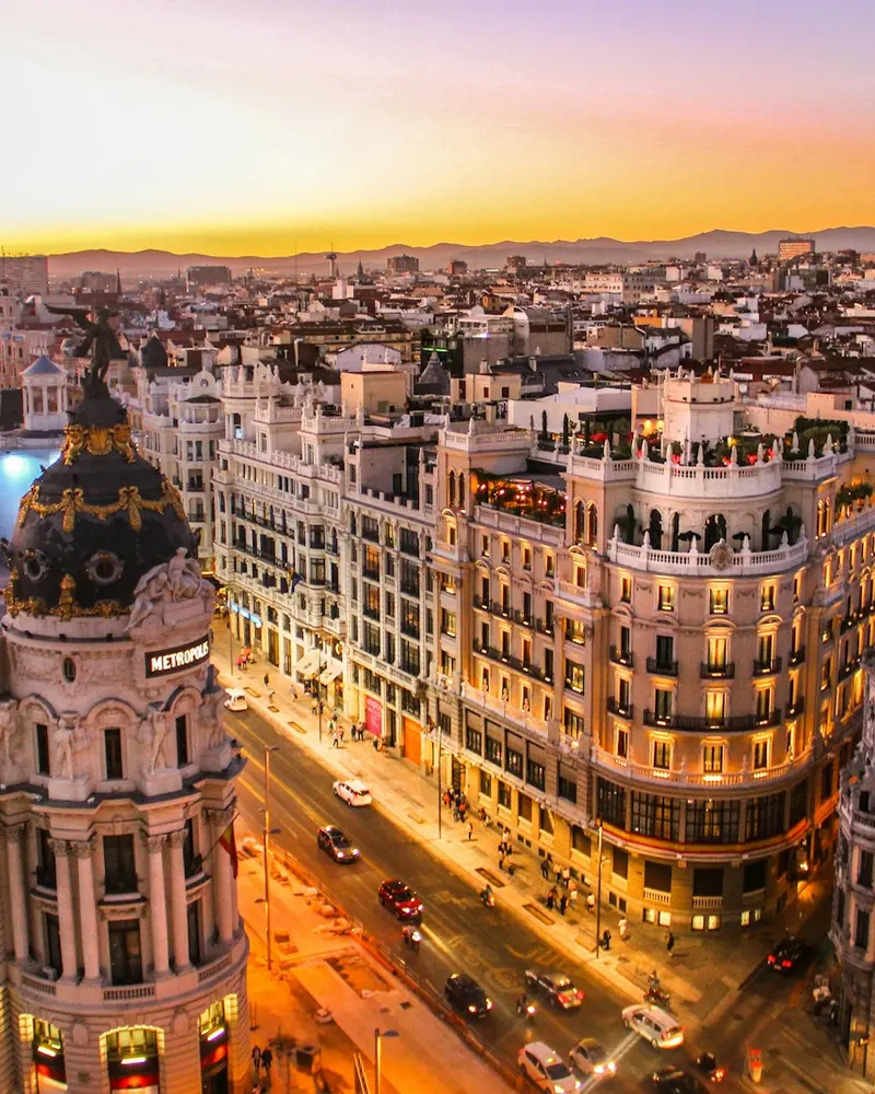 An aerial view of the Metropolis building and Gran Via in Madrid at low sun