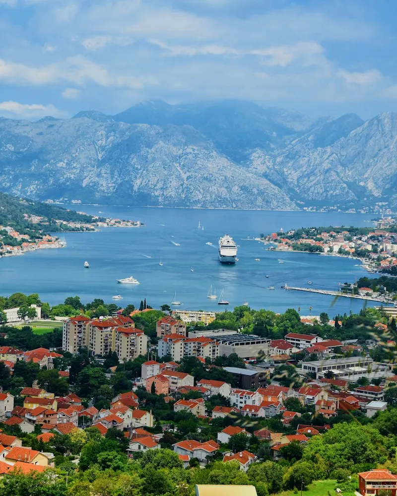 aerial view of city near body of water during daytime