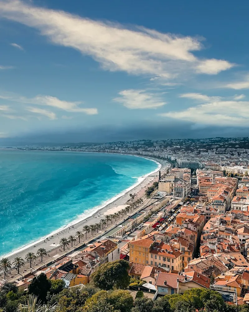 an aerial view of a city next to the ocean