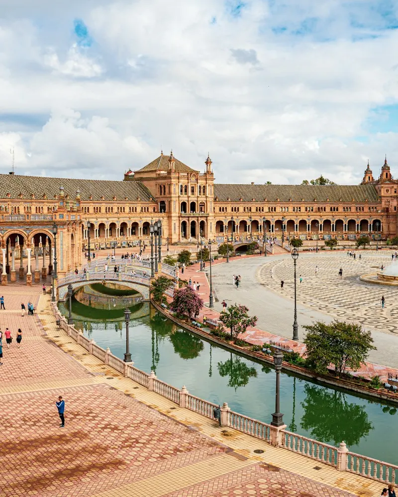 a large building with a fountain in front of it